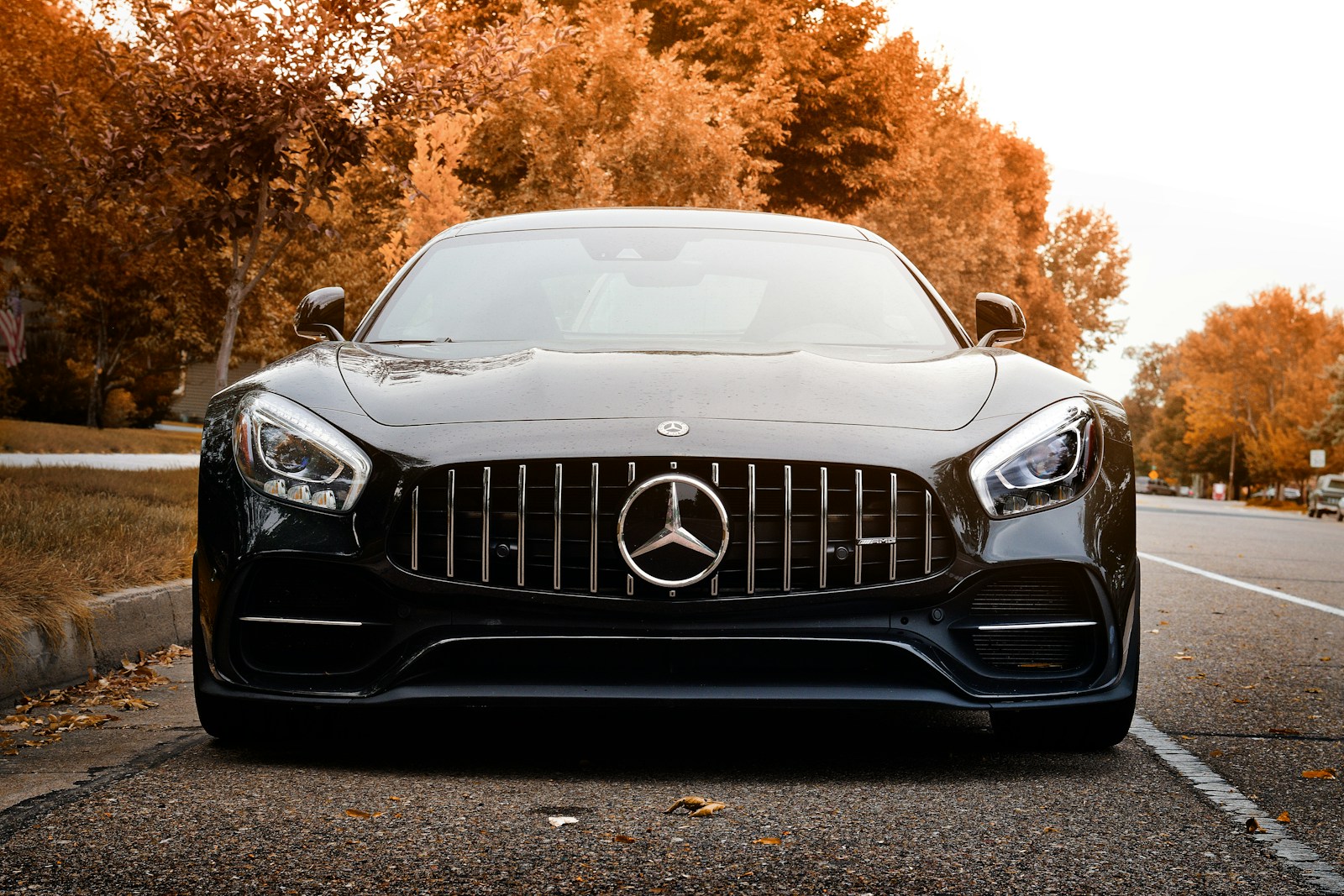 black mercedes benz car with automobile insurance on road during daytime