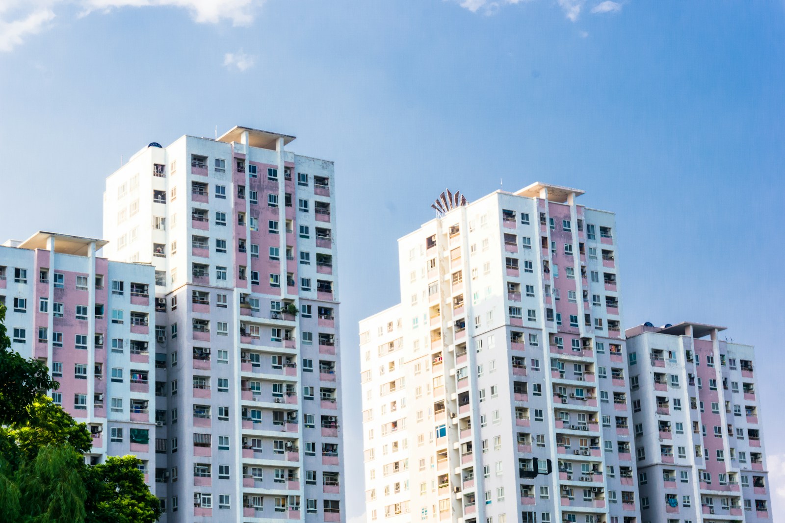 white concrete high rise building under blue sky during daytime